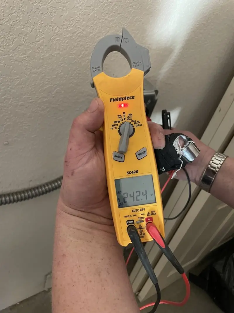 Voltage testing with clamp meter during Whole House Surge Protector in Sauk City